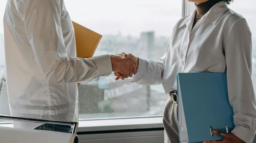 Man and woman shaking hands